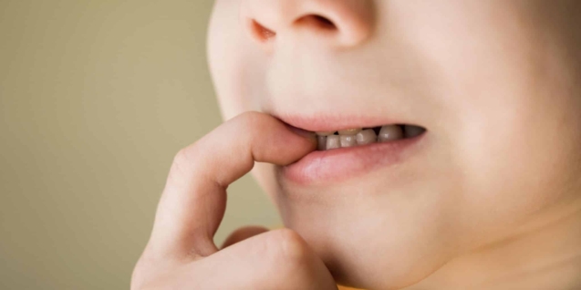 Blog 1 front-view-nail-biting-bad-habit-concept